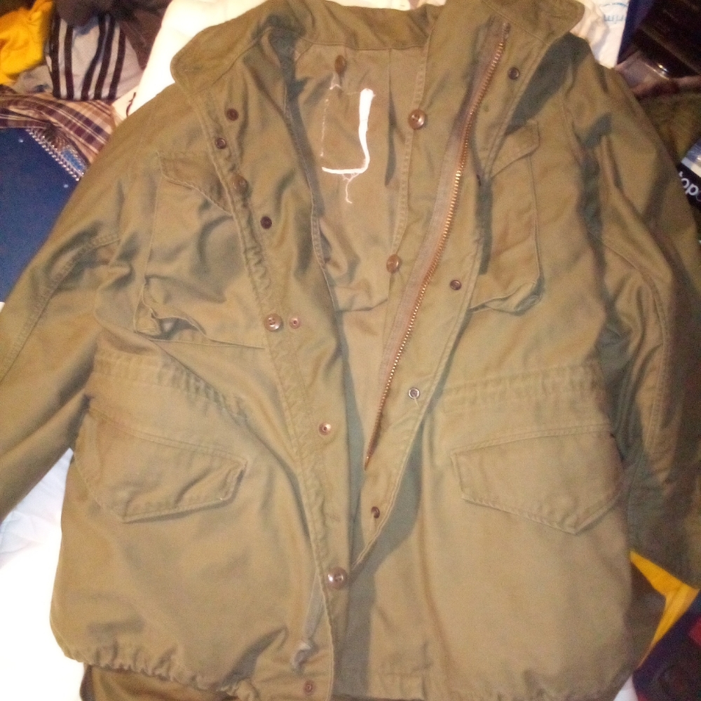 Men's military jacket with liner in excellent condition considering age.